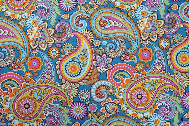 May include: A colorful paisley pattern fabric with a blue background. The fabric features a variety of paisley shapes in shades of orange, yellow, pink, and green.