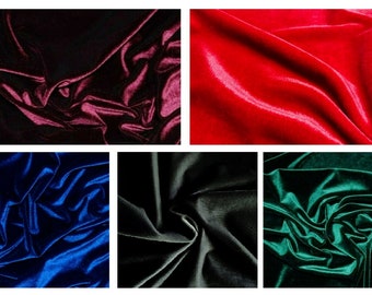 May include: Close-up of six different colors of velvet fabric. The colors are burgundy, red, blue, black, and green.