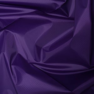May include: Close-up of a deep purple fabric with a subtle, textured pattern. The fabric is draped, creating folds and shadows that highlight its sheen. The color is a rich, saturated shade of purple.