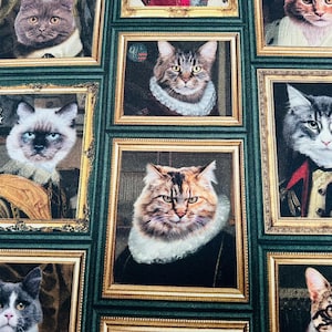 May include: A fabric design showcasing a repeating pattern of cats depicted in the style of historical portraits, set within gold frames. The background is a dark green, creating a striking contrast with the framed feline images.