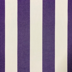 May include: Close-up of a fabric with vertical stripes. The stripes alternate between a deep purple and a cream color. The fabric has a textured appearance, suggesting it may be used for upholstery or home decor.