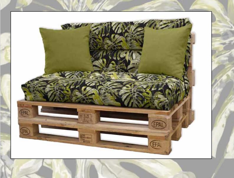 May include: A wooden pallet sofa with a black and green tropical leaf patterned cushion and two green throw pillows. The pallet is stamped with the word "EPAL".