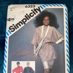 May include: Simplicity sewing pattern number 6325 for a dress and pants. The pattern is for sizes 12 miss. The pattern features a woman wearing a grey dress with a white scarf and a woman wearing a red dress and a woman wearing a black top and pants.