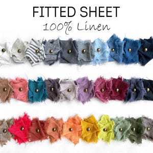 May include: A color swatch set for a fitted sheet made of 100% linen. The image displays three rows of fabric samples in various colors and patterns, each secured with a small gold-toned metal stud. The text FITTED SHEET 100% Linen is at the top.