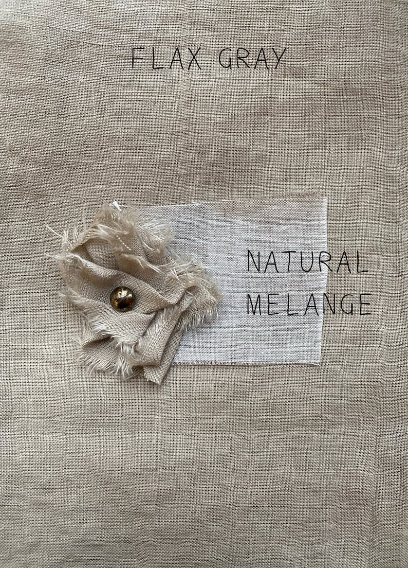 May include: Two fabric swatches, one labeled "FLAX GRAY" and the other "NATURAL MELANGE". The swatches are a light beige color and have a textured linen weave.