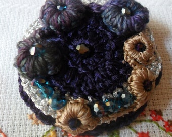 Brooch crocheted pale silk
