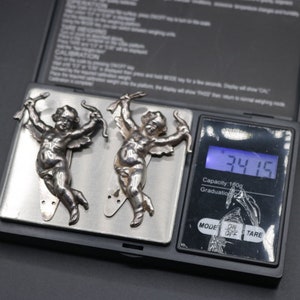 Vintage 1930s 1940s hand cast sterling silver Keim London cupid or cherub novelty dress clip pair 34.15g image 3