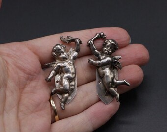 Vintage 1930s 1940s hand cast sterling silver Keim London cupid or cherub novelty dress clip pair 20.26g