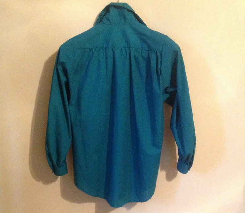 green shirt blouse