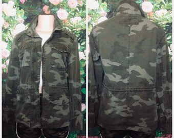 Camouflage jacket zips up the front