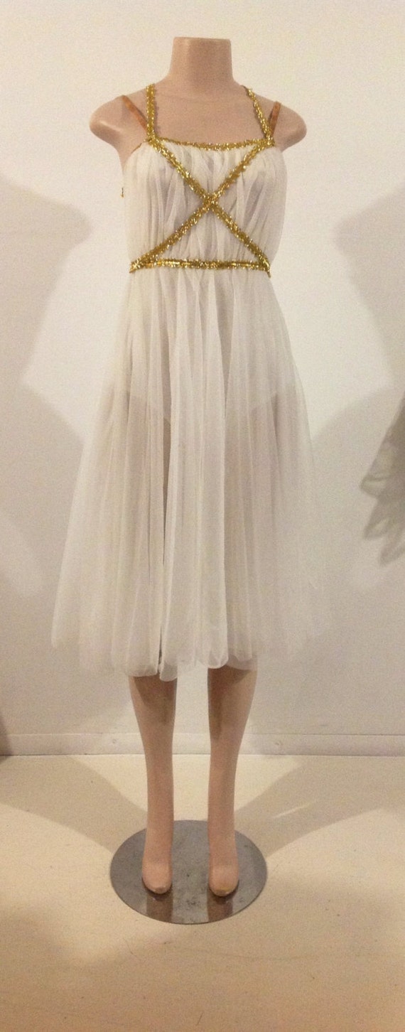 white dress with gold trim