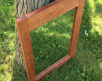 Wood and plant images reflect the growth of living things. cherry framed mirror etsy