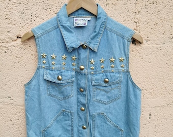 Vintage 1980s light blue sleeveless denim jacket waistcoat vest with metal star studded details from Monique Fashion size 10