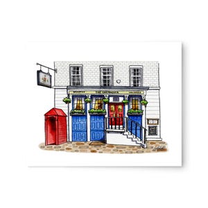 May include: A watercolor illustration of a pub called "The Grenadier" with a red door and blue doors on either side. The pub has a white brick facade with three windows and a sign above the door. There is a red phone booth in front of the pub.