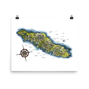 May include: A hand-drawn map of an island with a compass in the bottom left corner. The island is outlined in blue and green, with various land features labeled in black text.