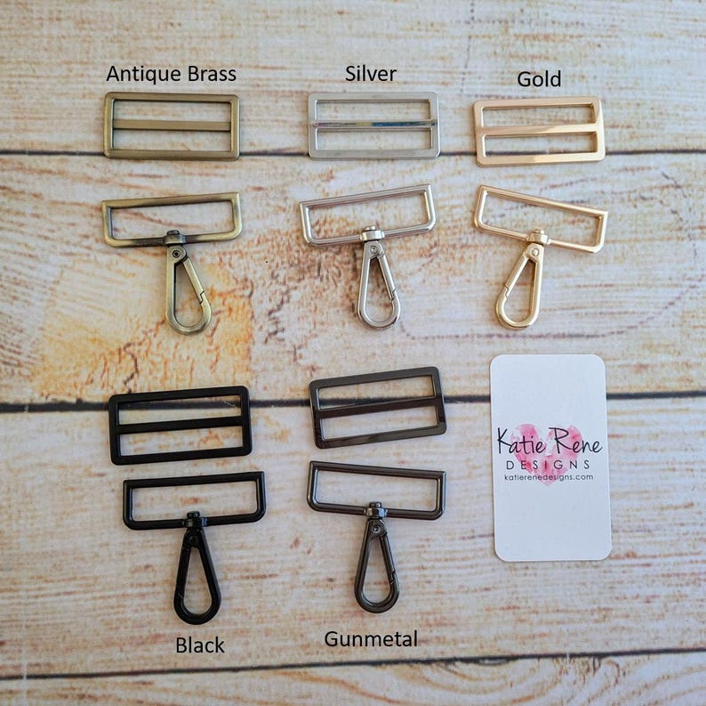 May include: Five different metal swivel clasps with two-bar slider buckles. The clasps are shown in antique brass, silver, gold, black, and gunmetal.