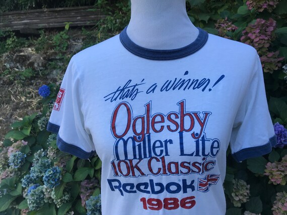 red white and blue reebok shirt