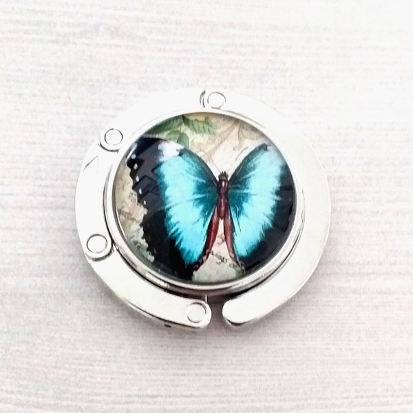 Vlindertashaak in lichtblauw en zwart, vlinders handtashanger, ronde compacte opvouwbare magnetische tafelrand draagtashouder