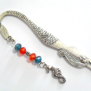 Mermaid tail metal bookmark with silver tone seahorse charm.  Orange and teal crystal beads were used in this handmade mythical beach book accessory. The book hook is durable and will fit any size book, planner or journal.  A 5 inch full size hook.