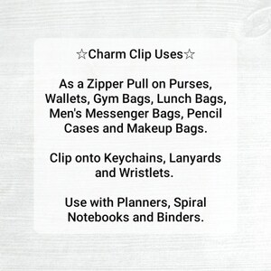 May include: White card with the text "Charm Clip Uses" and a list of applications: zipper pulls, keychains, lanyards, planners, notebooks, and binders. The card is on a light wood grain background.