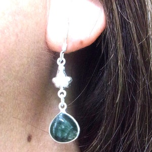 Exquisite handcrafted Seraphinite and sterling silver drops. Beautiful artist design, 1.95in Long. The Gem is approx. .50in diameter.