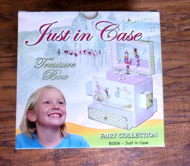 Adorable "Just In Case" Fairy Musical Treasure Box with four secret drawers in which girls can storage their tiny treasures.
The little fairy figurine moves with the melody that rings out.  
Measures: 6" x 6" x 4" W.  New in the original box.
 Was opened only to take the photos.