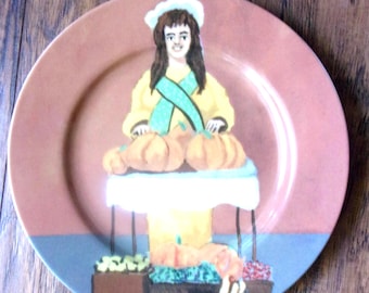 La Citrouille Dame Porcelain Plate: Marche Aux Fleurs- Guy Buffet- Pumpkins Vendor Lady-New