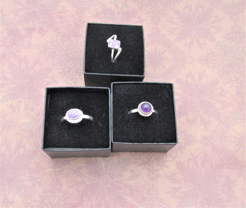 Small everyday rings, Made of 925 sterling silver and genuine gems. Each gem is approx. 1/4"
Round Amethyst is size 9
Rectangular Amethyst is size 8
Lavender oval shape size 9 gorgeous gemstone.