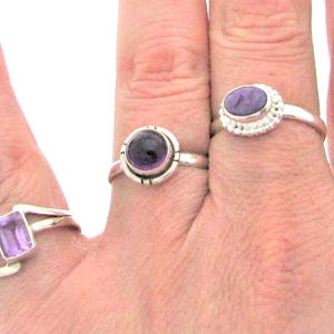 Small everyday rings, Made of 925 sterling silver and genuine gems. Each gem is approx. 1/4"
Round Amethyst is size 9
Rectangular Amethyst is size 8
Lavender oval shape size 9 gorgeous gemstone.