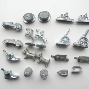 Game Piece Movers, 20 pot metal pieces.