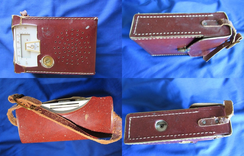 May include: A vintage maroon leather-cased radio with a white dial and a gold-coloured knob. The case has a perforated speaker area and white stitching. A leather strap is attached. The radio is displayed from multiple angles.