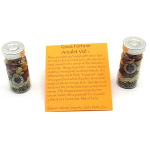May include: Two small glass jars filled with various items, including seeds, stones, and a horseshoe charm. The jars are labeled "Good Fortune Amulet Vial..." and are said to bring good luck, abundance of food, power to the owner, and the attraction of money. The text also mentions that the items are from Peru and contain plant material, minerals, and symbolic objects.