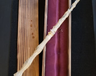 Hand made white oak wand gem encrusted, with red velvet finished case.