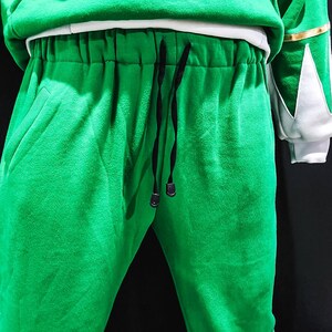 More than just clothing, the MMPR Green Hoodie is a wearable tribute to classic Power Rangers style, featuring warm fleece construction and durable vegan leather detail work. It’s a perfect blend of nostalgia, craftsmanship, and modern fashion.