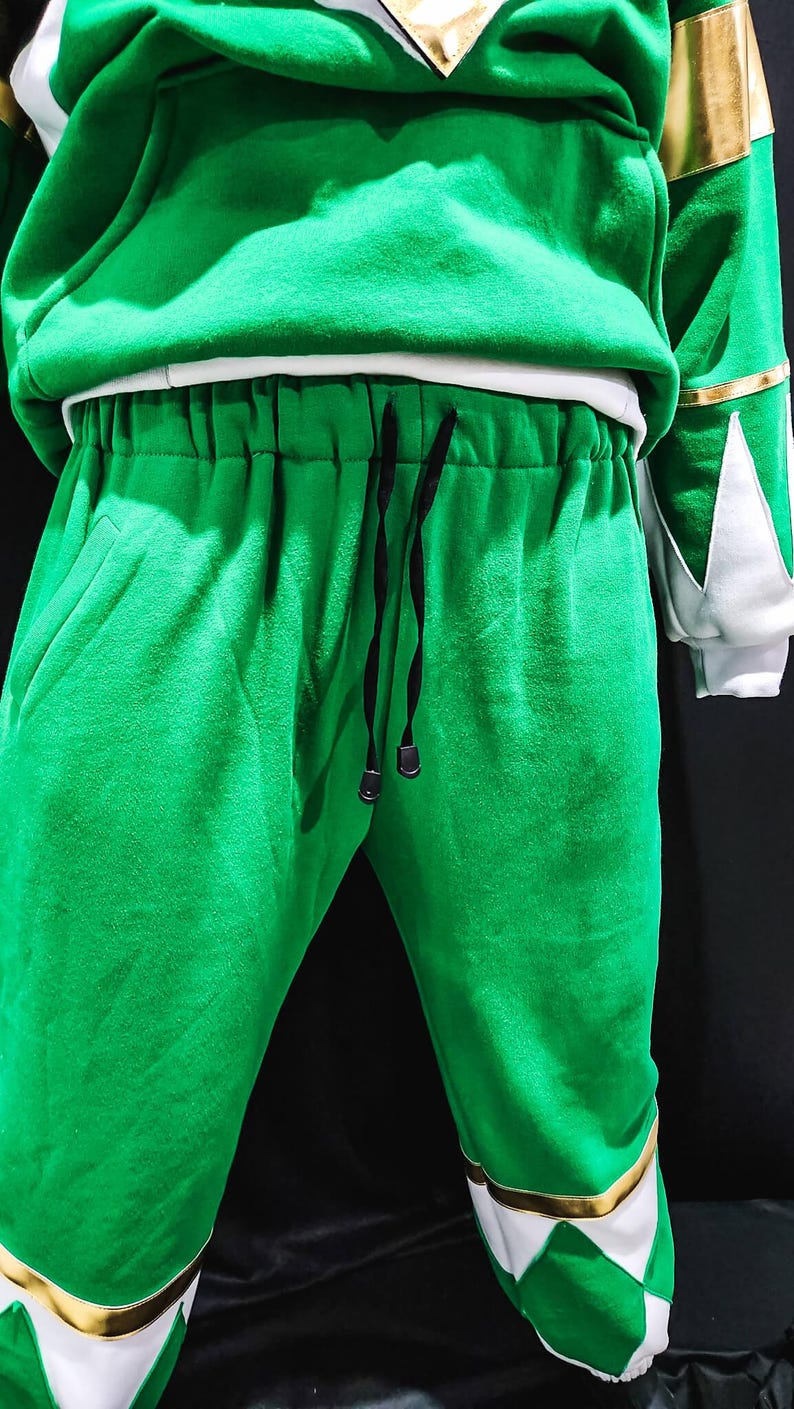 More than just clothing, the MMPR Green Hoodie is a wearable tribute to classic Power Rangers style, featuring warm fleece construction and durable vegan leather detail work. It’s a perfect blend of nostalgia, craftsmanship, and modern fashion.