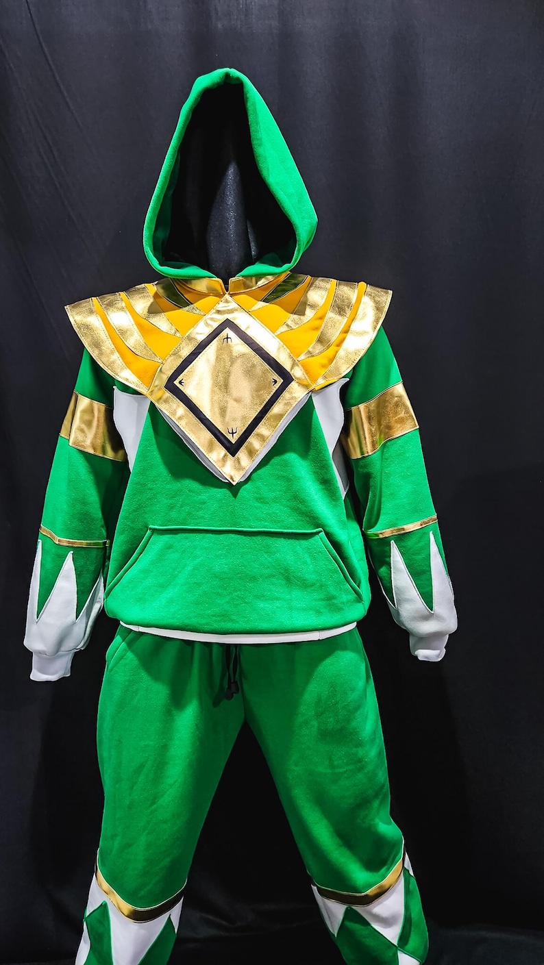 This MMPR Green Hoodie is a tribute to legendary Power Rangers legacy, combining comfortable fleece fabric with high-quality vegan leather detailing and an optional lighting effect upgrade, transforming it into a powerful fashion statement.