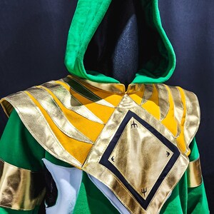 Unleash your inner hero with the MMPR Green Custom Hoodie Power Ranger. Designed from soft fleece with custom-fit precision and sleek vegan leather accents, this hoodie gives you legendary flair without sacrificing comfort. Custom sizing ensures it fits like a glove.