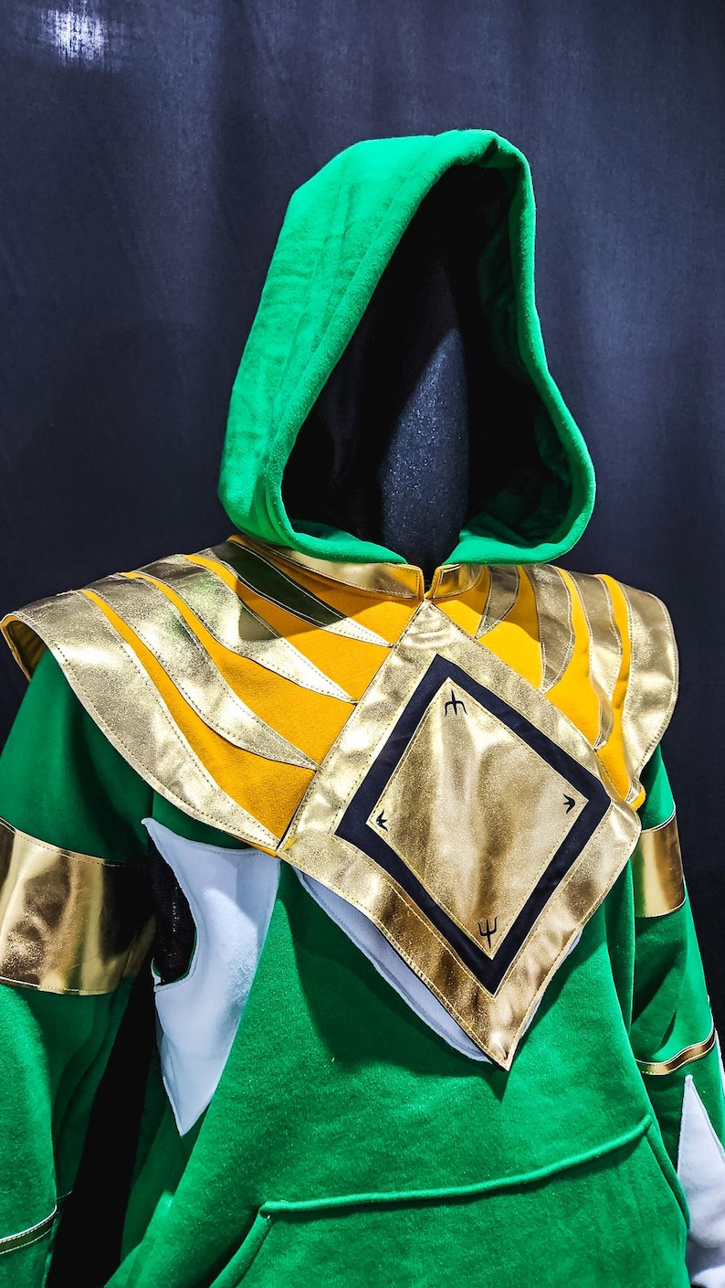 Unleash your inner hero with the MMPR Green Custom Hoodie Power Ranger. Designed from soft fleece with custom-fit precision and sleek vegan leather accents, this hoodie gives you legendary flair without sacrificing comfort. Custom sizing ensures it fits like a glove.
