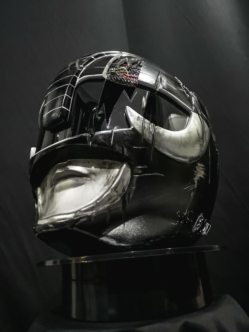 Battle-worn Black Ranger MMPR Helmet Damaged Custom, handcrafted from resin/fiber with optional lighting. A collector-grade piece made to order—perfect for cosplay or display.