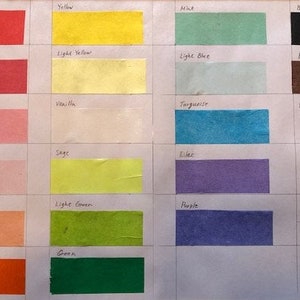 May include: Color chart with 20 different colored paper samples. The colors include red, hot pink, mid pink, light pink, peach, orange, yellow, light yellow, vanilla, sage, light green, green, mint, light blue, turquoise, lilac, purple, black, brown, and white.