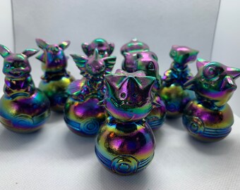 Assorted aura obsidian Pokémon sitting on Pokeball