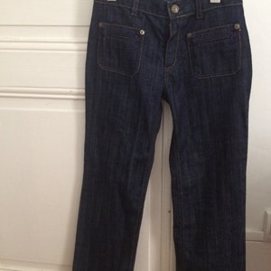 Bellissimi jeans bootcut in caucciù taglia 12 anni