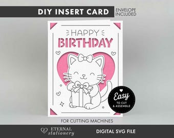 May include: A DIY insert card digital SVG file for cutting machines featuring a white card with a pink heart cutout. The card displays a black outline illustration of a cat with a bow holding a gift box and the text HAPPY BIRTHDAY. A black circular badge reads EASY TO CUT & ASSEMBLE.