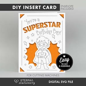 May include: A white DIY insert card with orange backing featuring a superhero illustration and the text You're a SUPERSTAR Birthday Boy! The card includes corner accents, star and lightning bolt graphics, and a black circular badge with the text Easy TO CUT & ASSEMBLE. The design is intended for use with digital cutting machines.