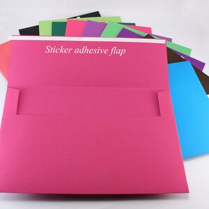 May include: A stack of colorful envelopes with a sticker adhesive flap. The top envelope is pink and has a white flap.