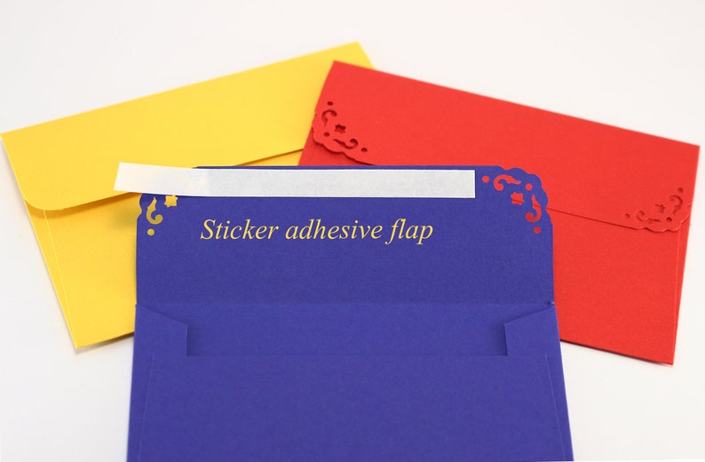 May include: Three envelopes with decorative edges. The top envelope is yellow, the middle envelope is blue with a white sticker flap that says "Sticker adhesive flap", and the bottom envelope is red.