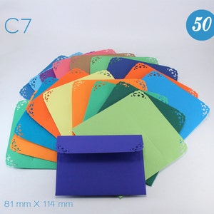 May include: A pack of 50 colourful envelopes with a decorative scalloped edge. The envelopes are 81 mm x 114 mm and are arranged in a fan shape. The envelopes are a variety of colours, including blue, green, orange, yellow, and purple.