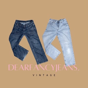 May include: Two pairs of vintage denim jeans, one dark blue and one light blue, laid out on a brown background. The jeans are both in a relaxed fit style. The text "Dear Fancy Jeans, Vintage" is displayed below the jeans.