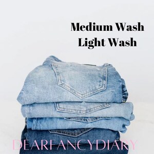 May include: A stack of blue denim jeans, with the top pair being a medium wash and the bottom pair being a light wash. The text "DEARFANCYDIARY" is visible at the bottom of the image.