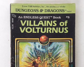 May include: A book cover with a black background and a green border. The title is "Villains of Volturnus" and it is an "Endless Quest" book, number 8. The cover art features a group of characters in a fantasy setting, with a large, glowing orb in the background.